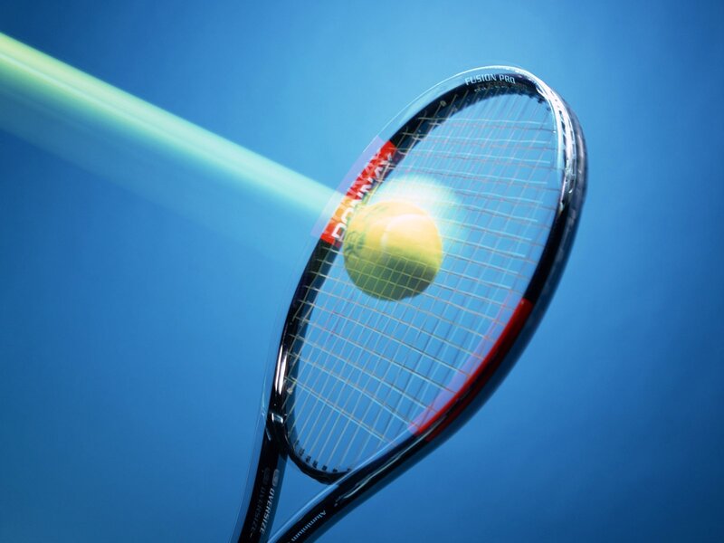 tennis racket hitting ball