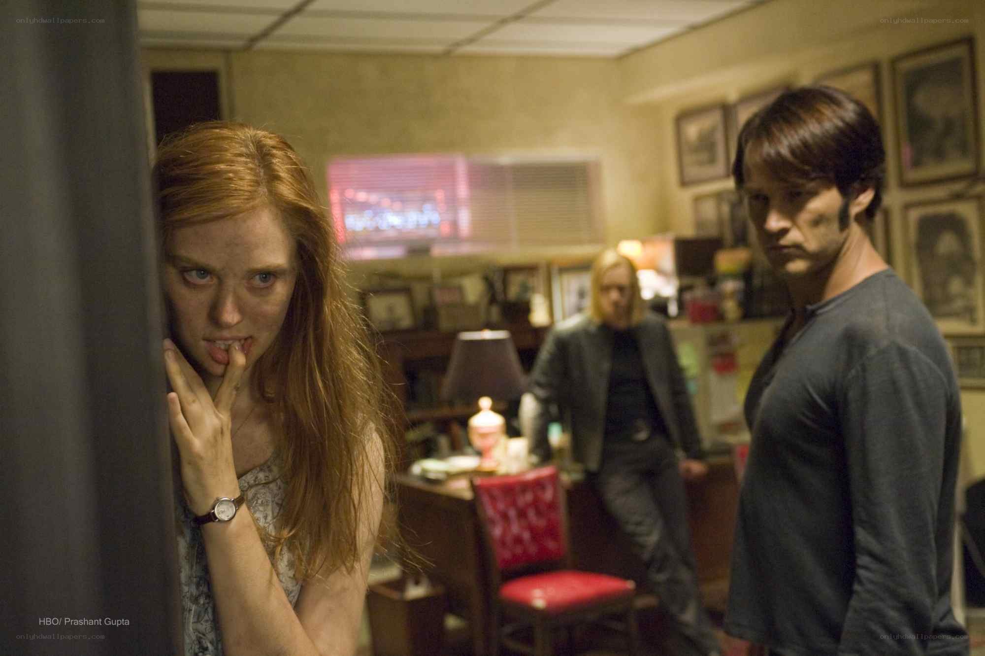 tense scene in a dimly lit room