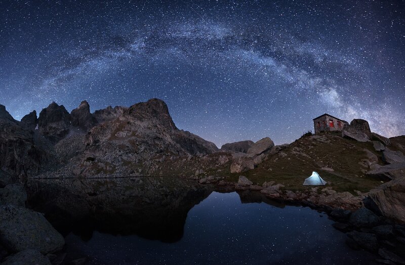 Tent and Hut under Stars