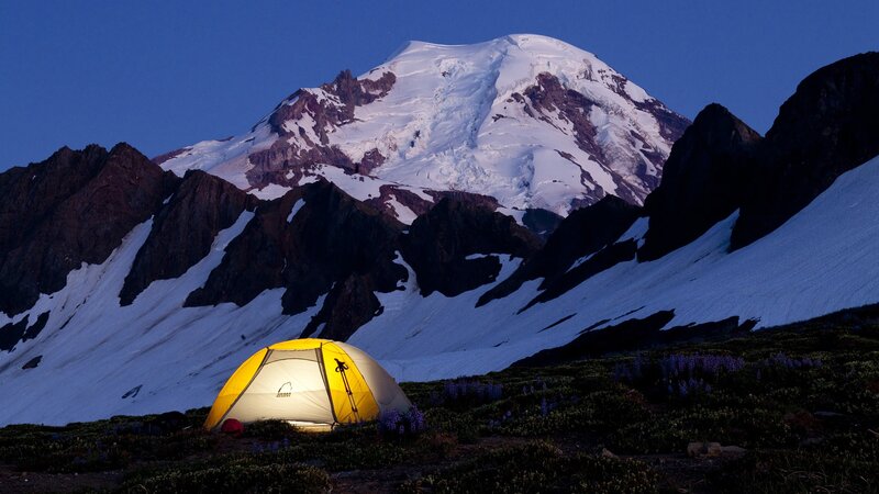 Tent at base of snow-capped mountain