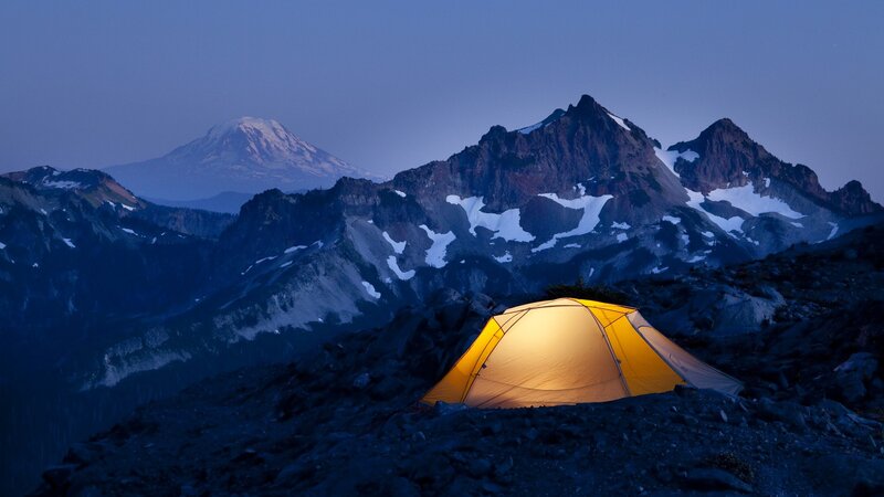 Tent at dusk in the mountains