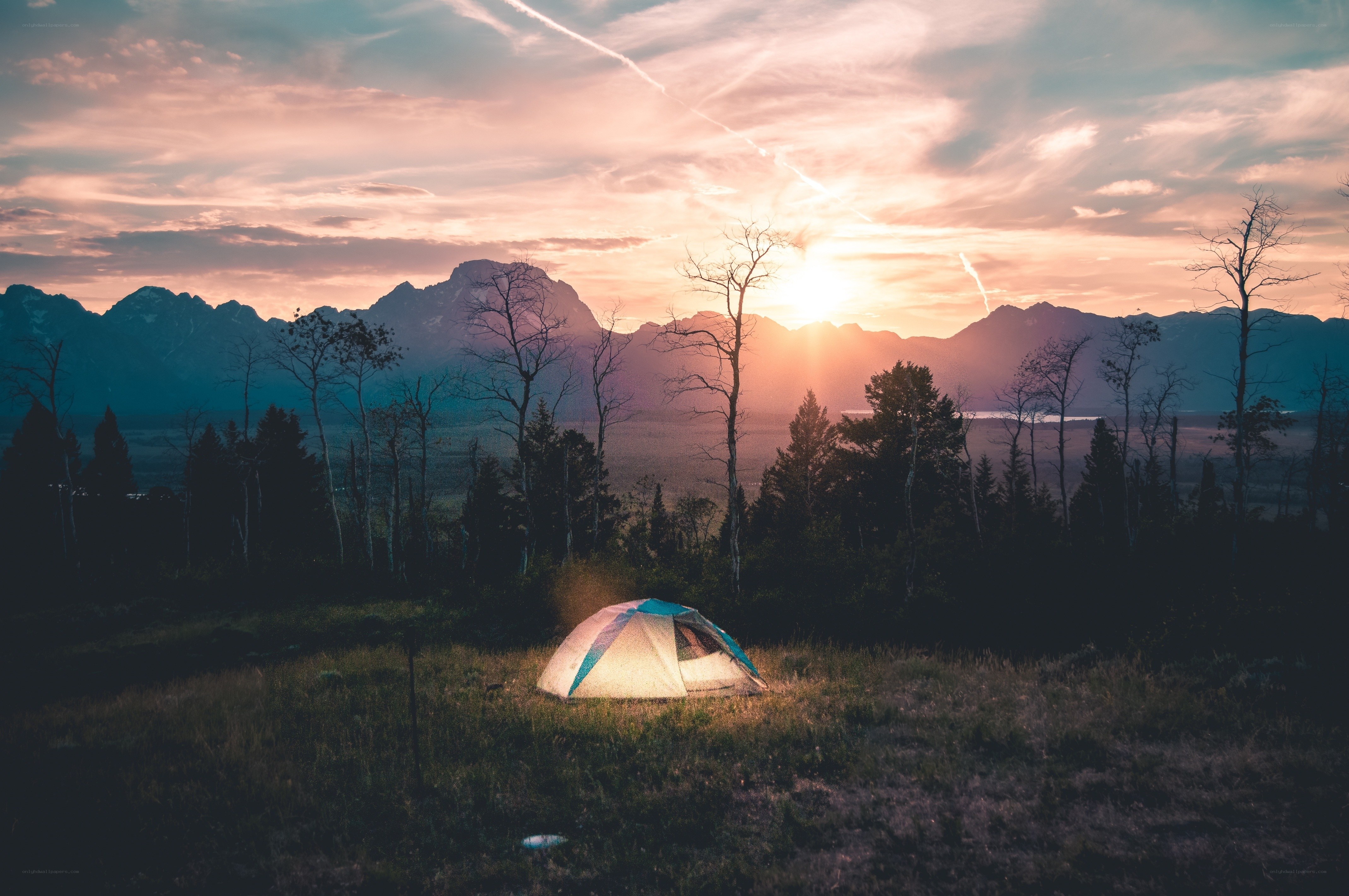 Tent at sunset in mountains