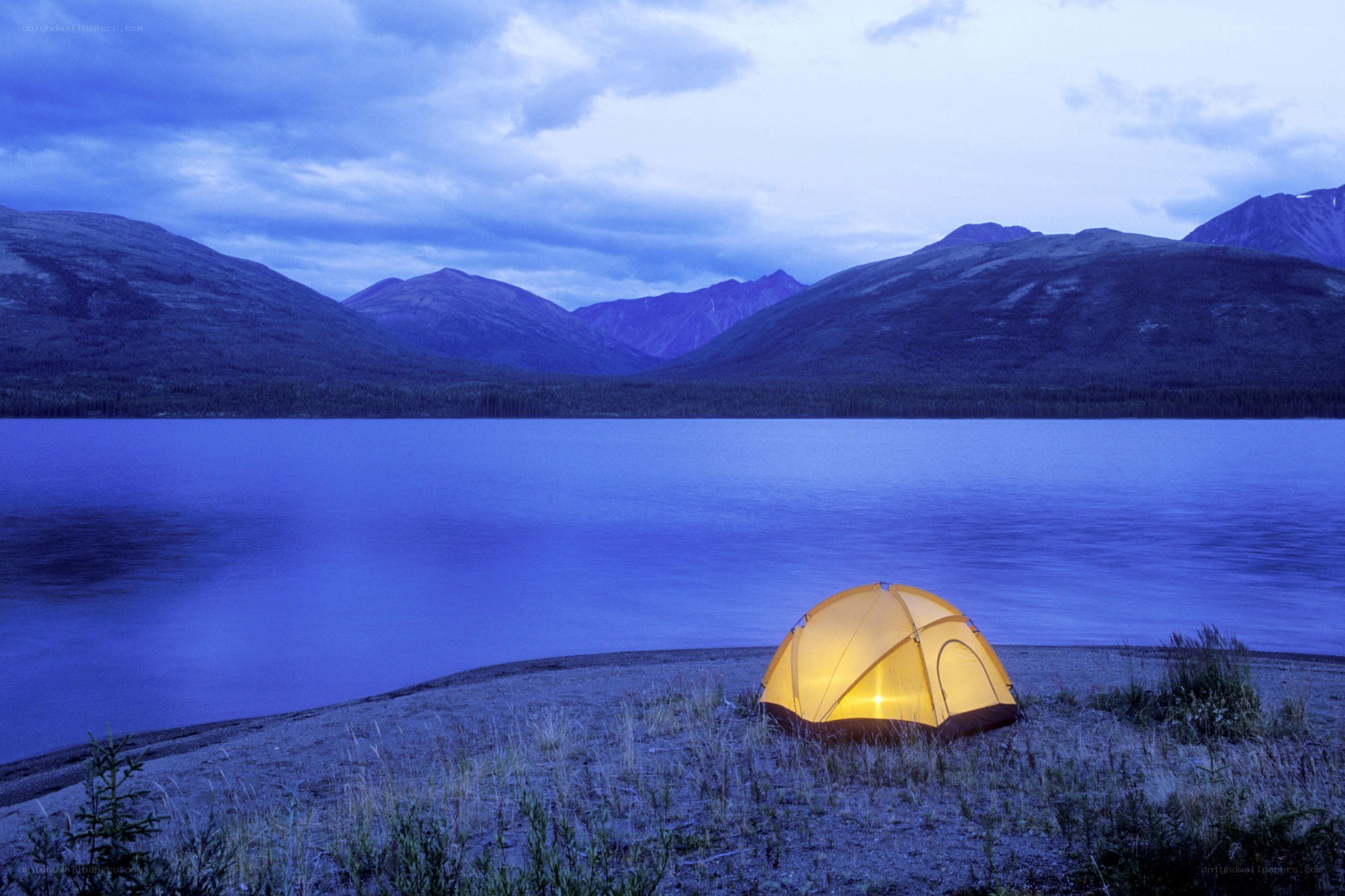 tent by lake at dusk