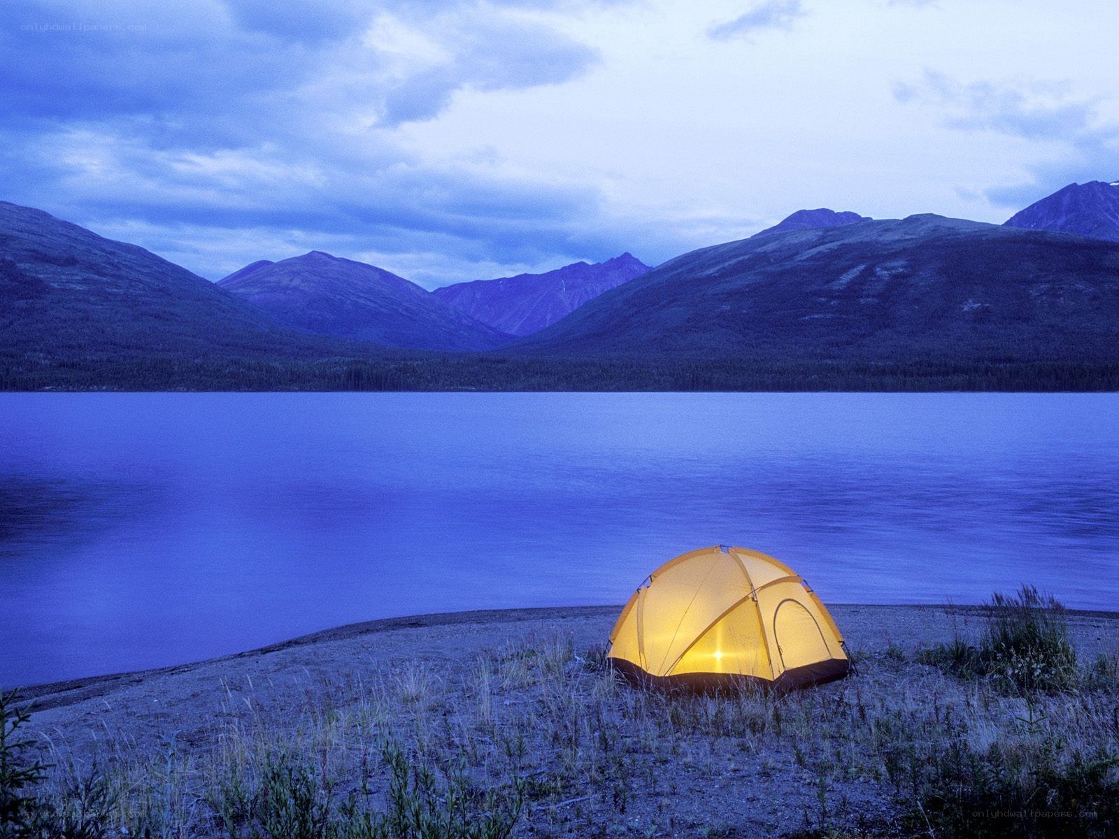 tent by lake at dusk