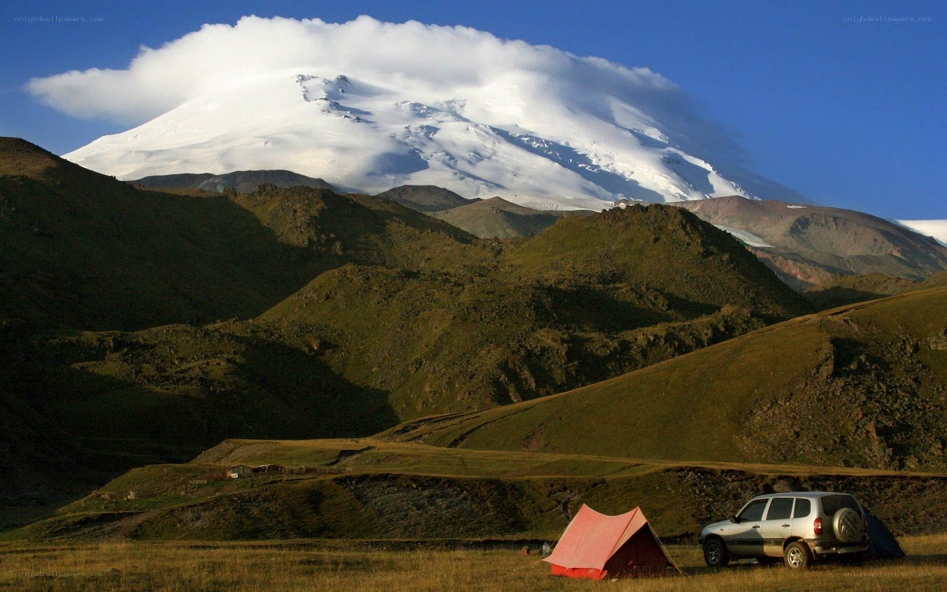 Tent camp near snowy mountain