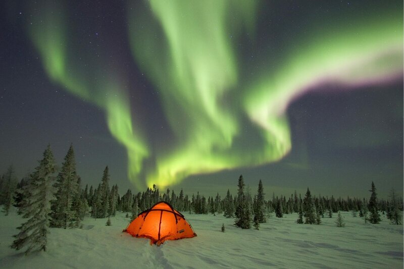 Tent under aurora borealis