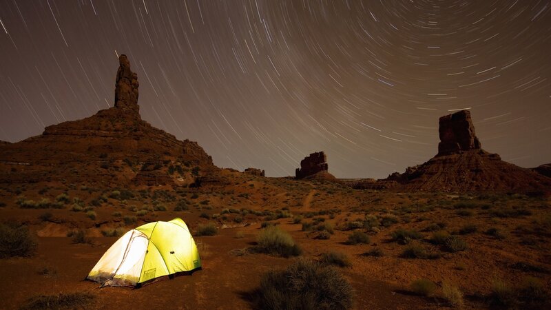 Tent under star trails