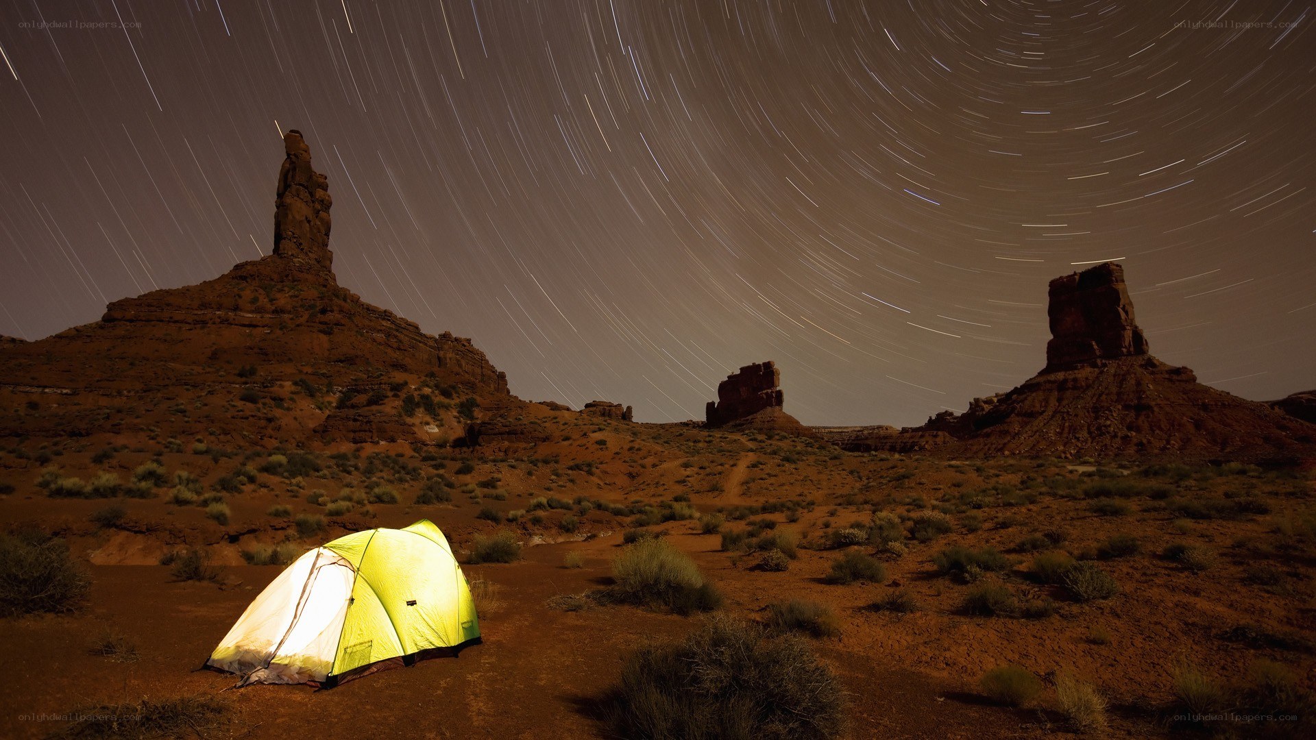 Tent under star trails