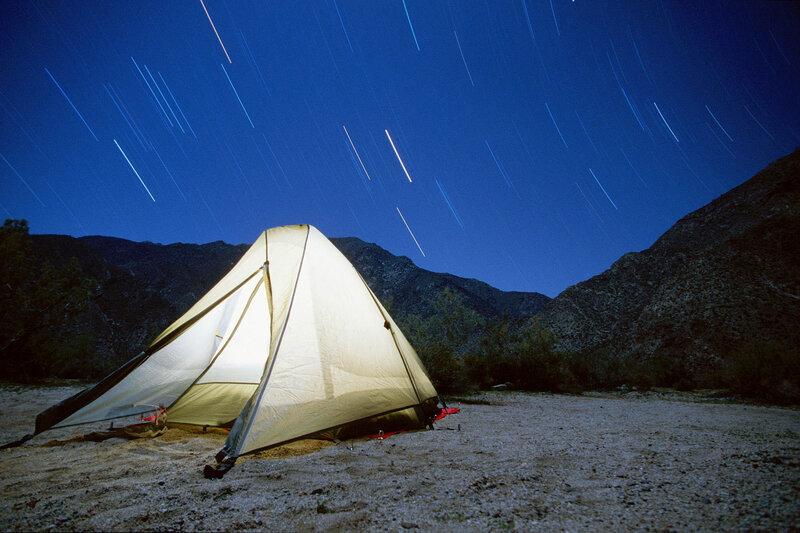 Tent under star trails