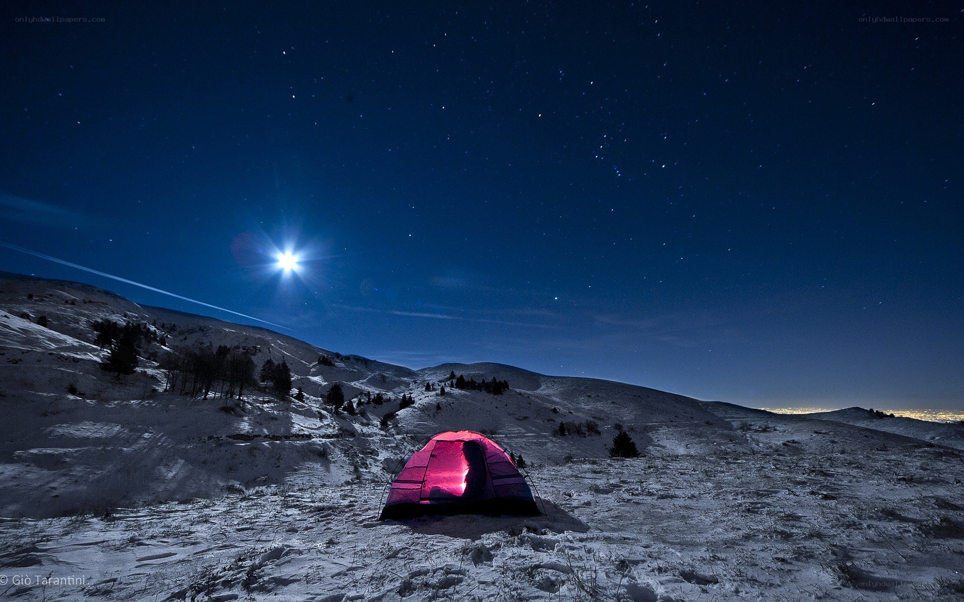 Tent under starry night sky