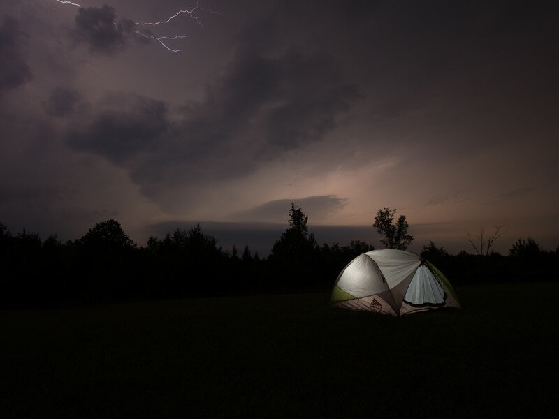 Tent under stormy sky