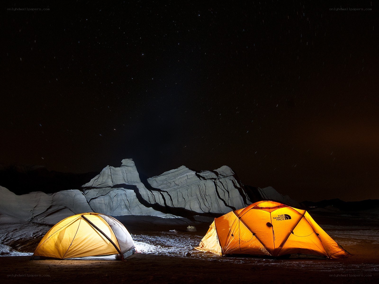 Tents under a starry night sky
