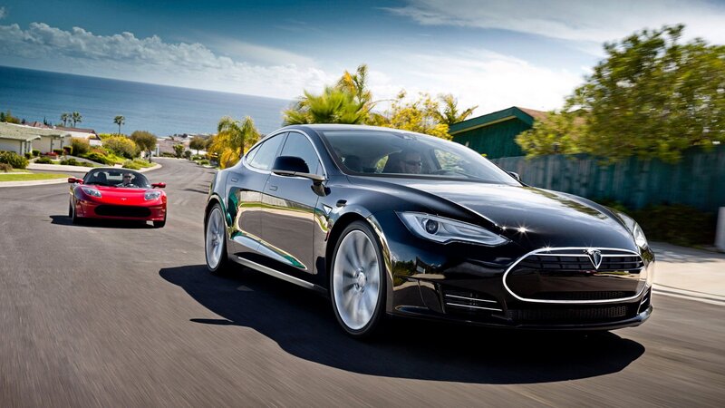 Tesla Model S and Roadster on coastal road