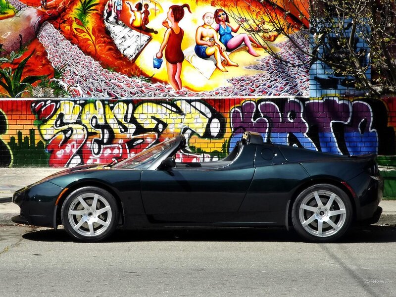 Tesla Roadster in front of mural
