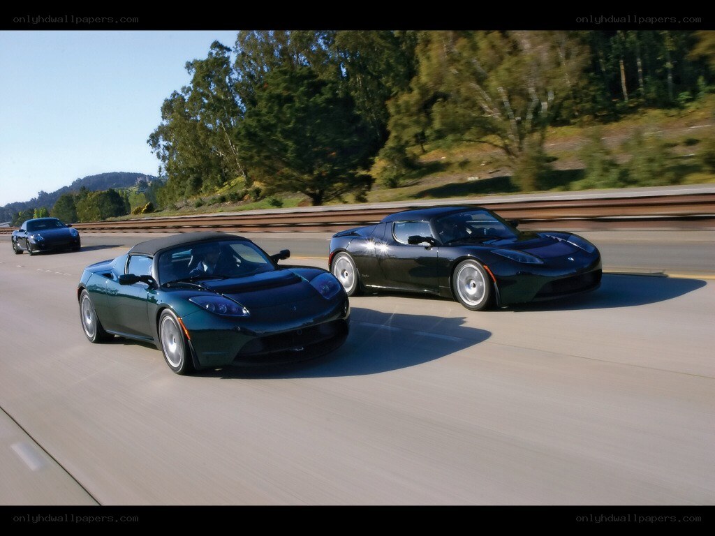 Tesla Roadsters on a highway
