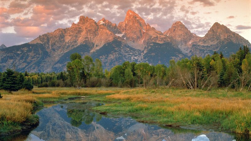 Tetons at sunset with river reflection