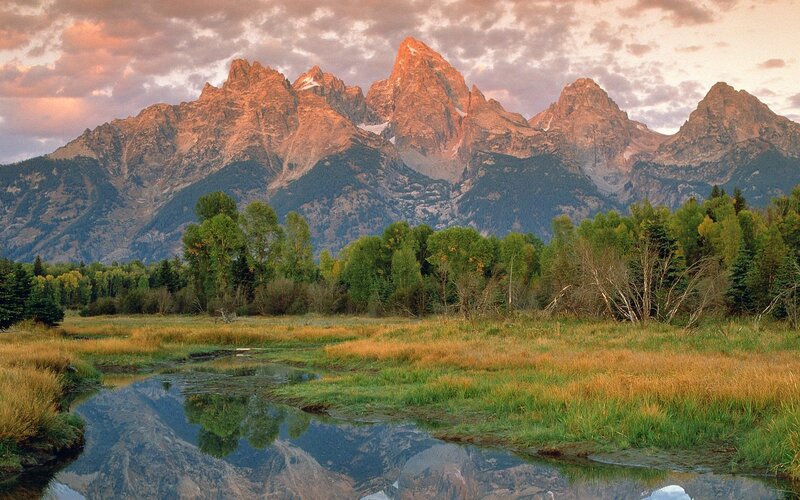 Tetons at sunset with river reflection