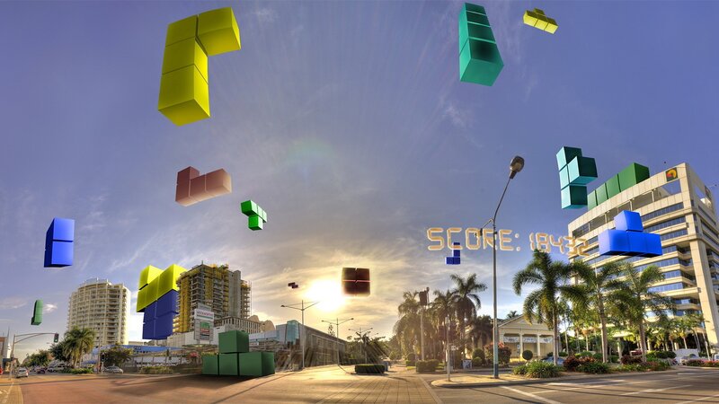 Tetris blocks over city street