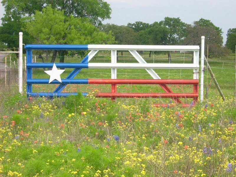 Texas flag gate in wildflowers