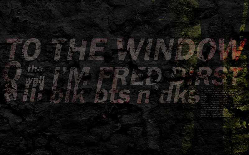 text on a dark wall