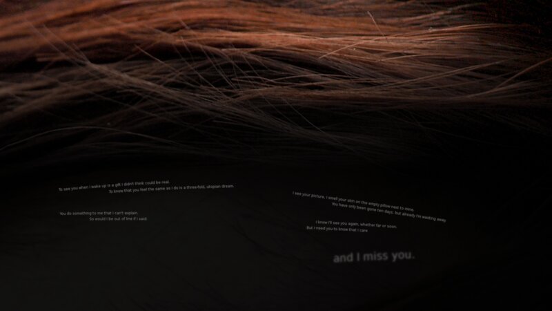 text on dark hair