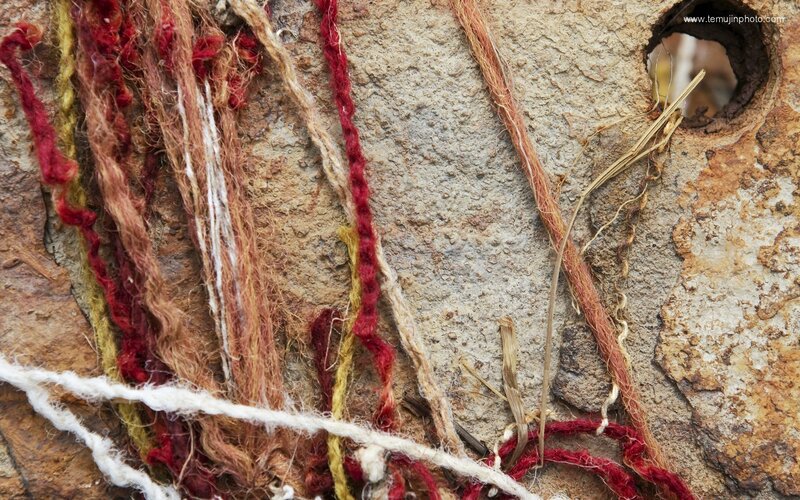 Textiles on a stone wall