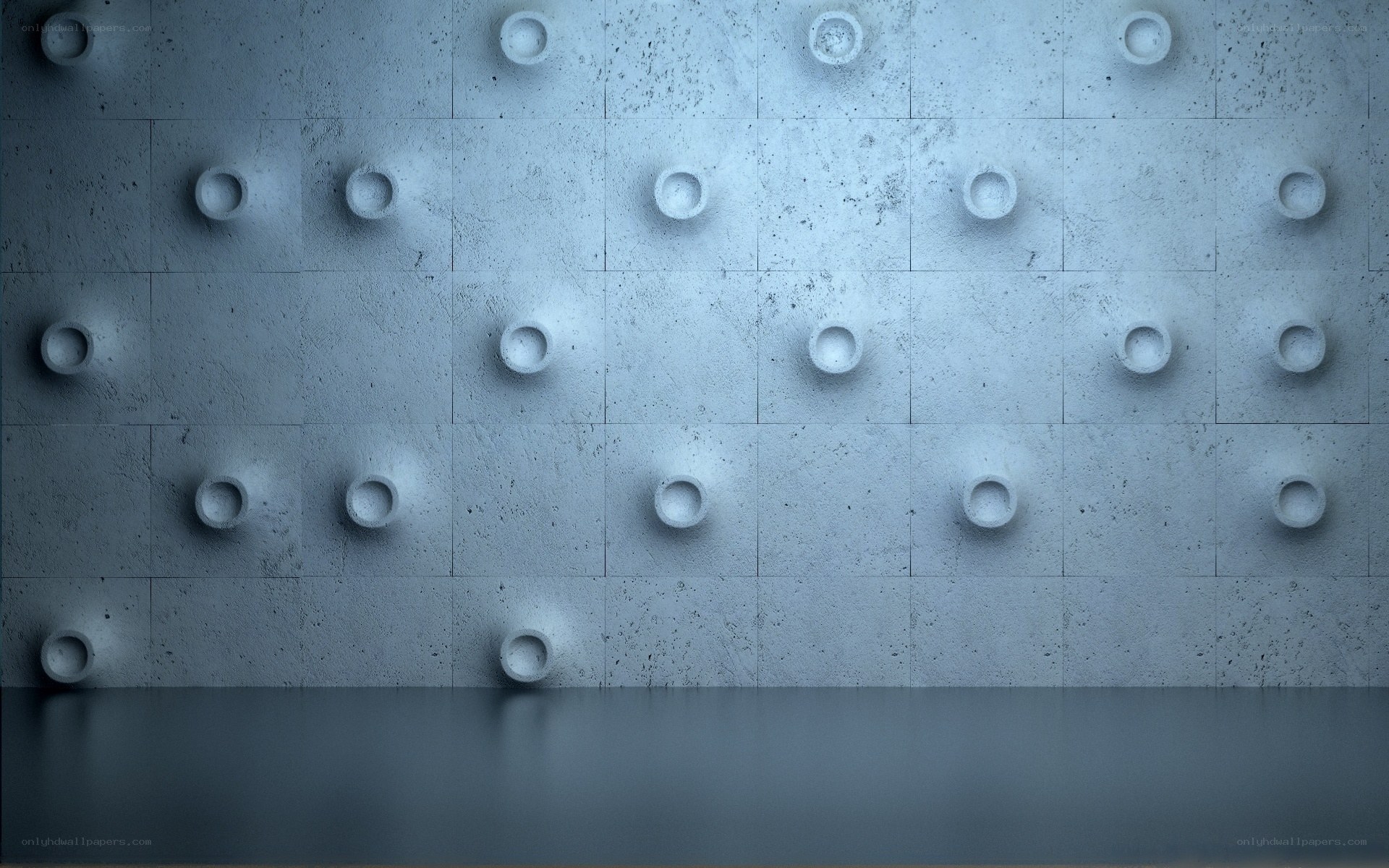 textured concrete wall with circular indentations