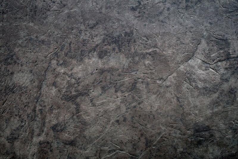 textured dark stone surface