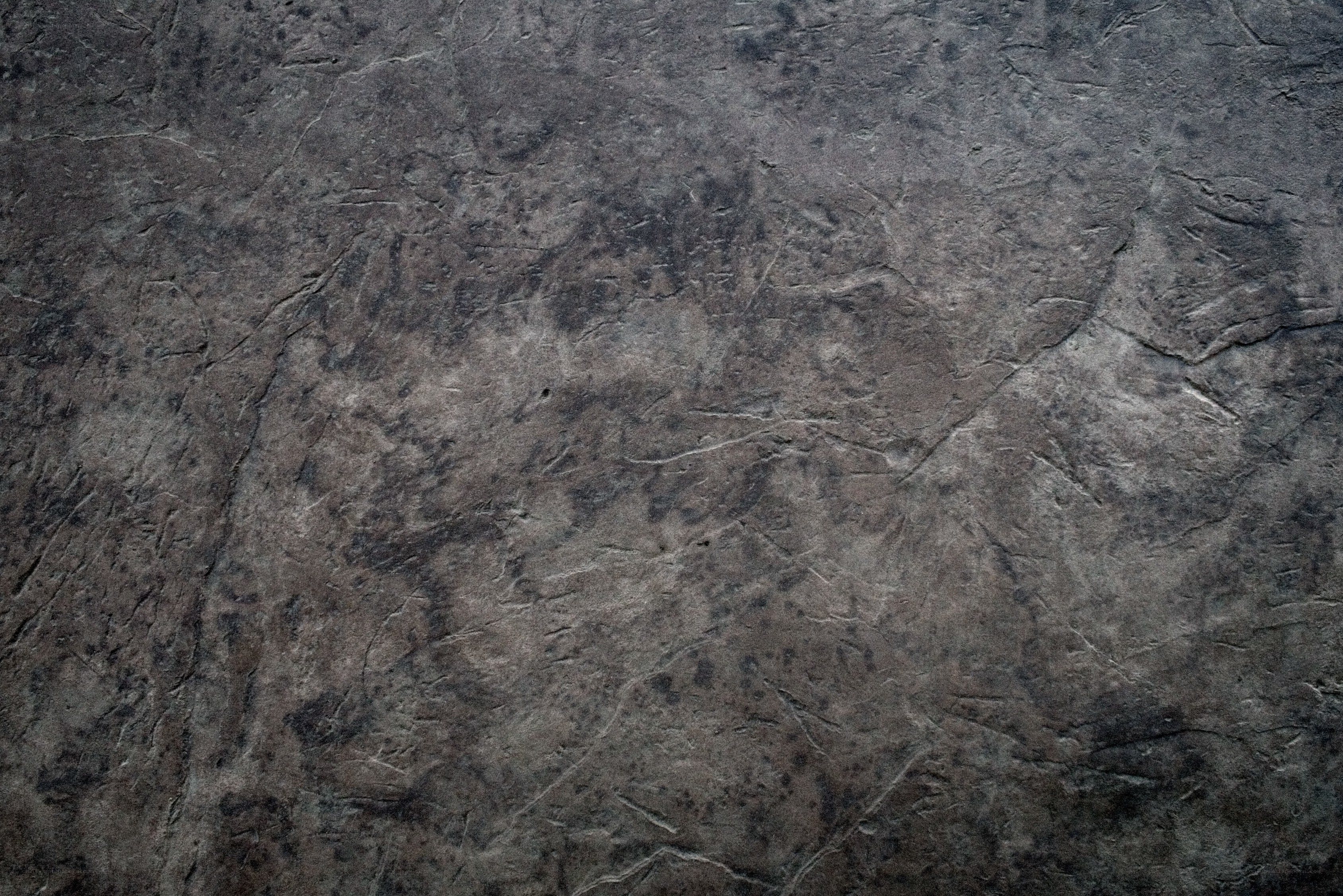textured dark stone surface