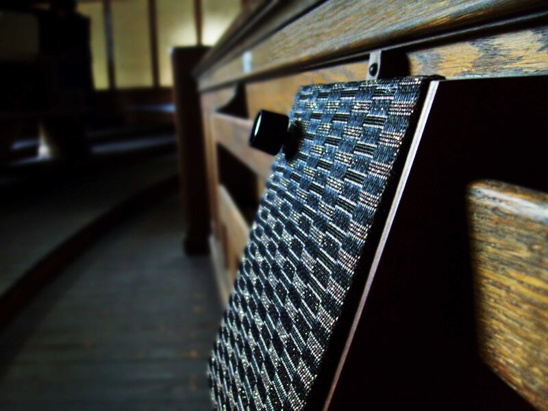 textured fabric on wooden bench
