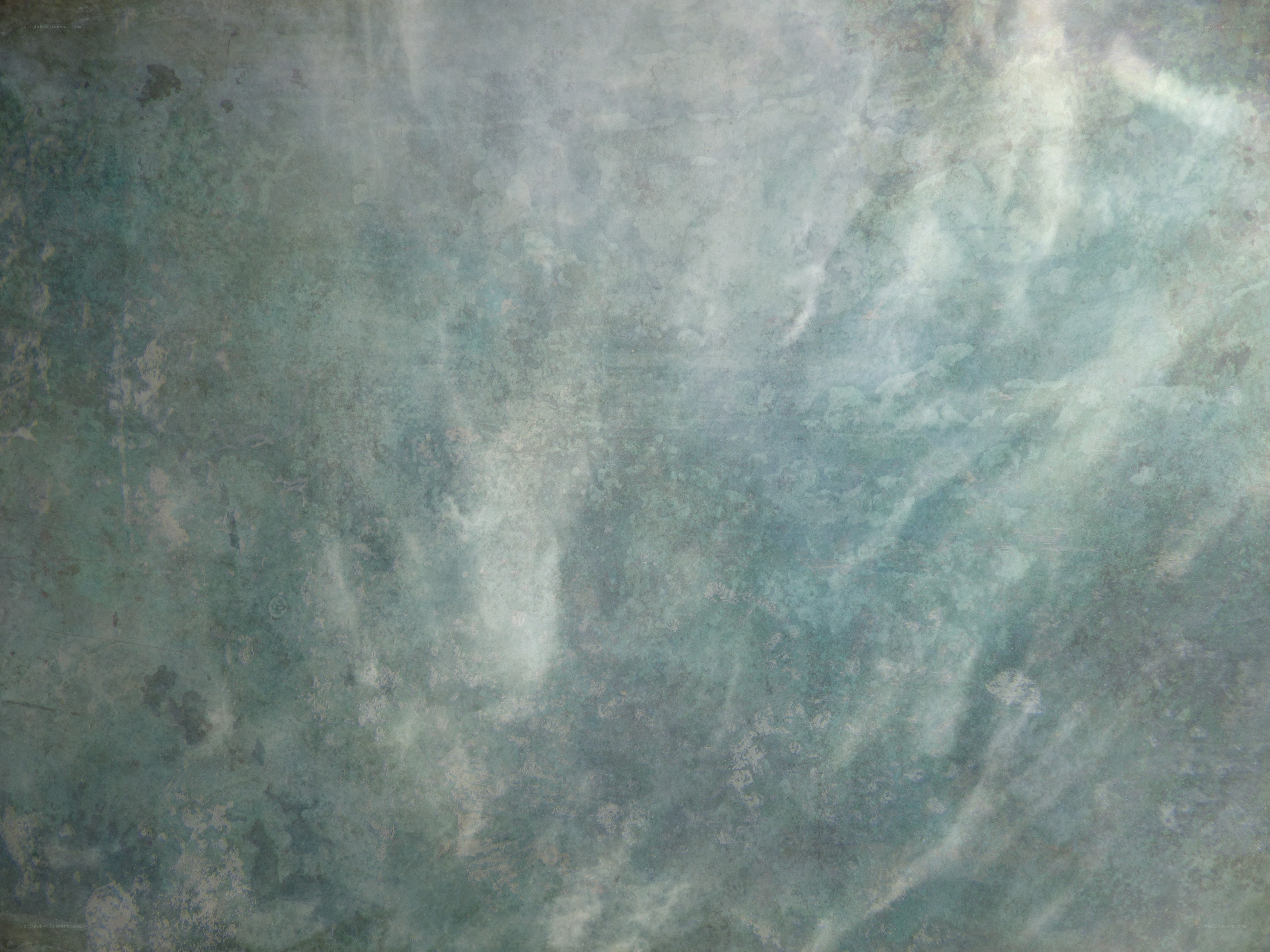 textured green-blue surface