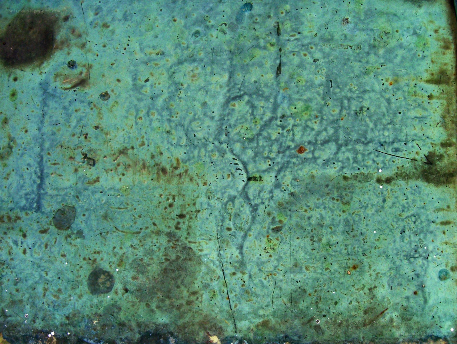 textured green surface with stains