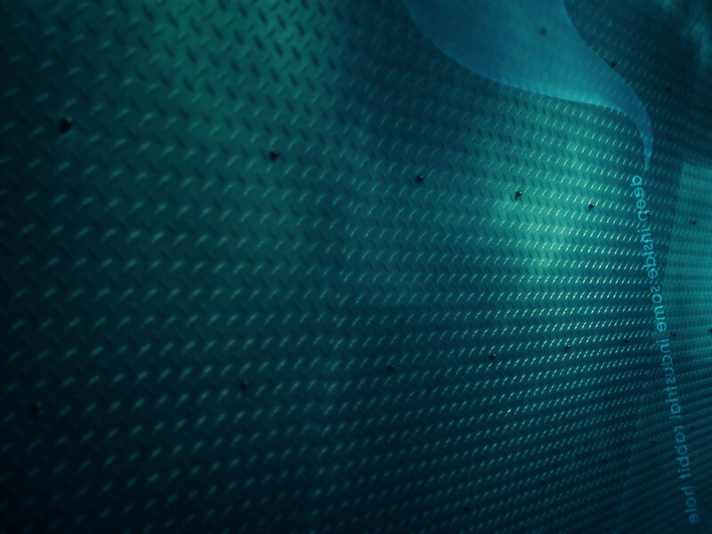 textured metal surface with text