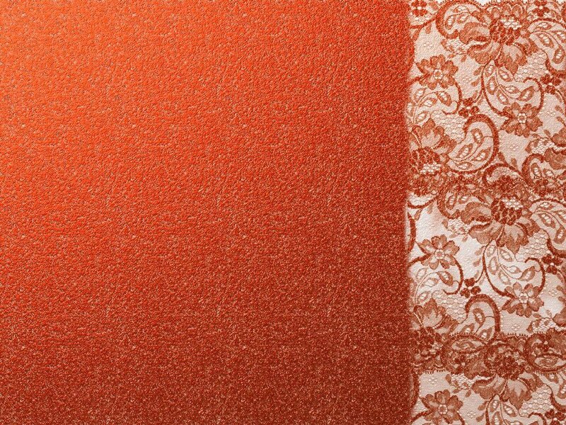 textured orange fabric with lace