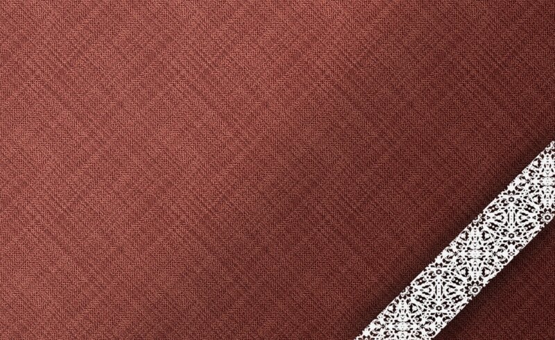 textured red fabric with lace trim