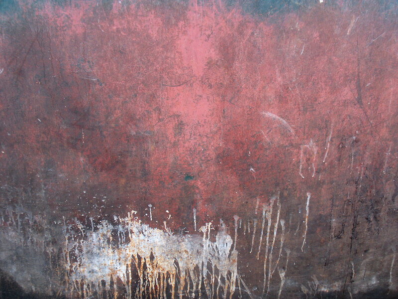 textured red surface with drips