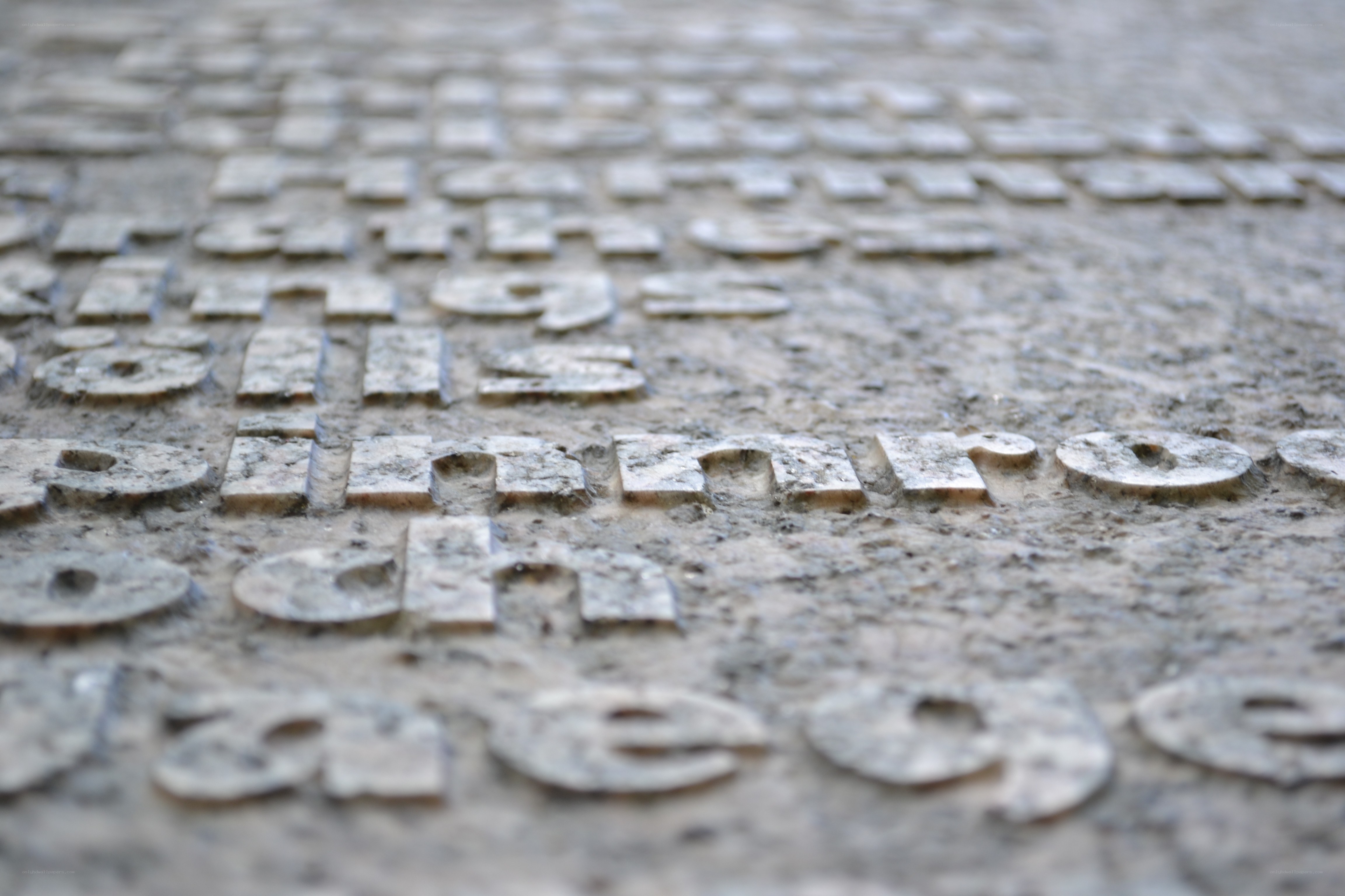 textured stone with engraved letters