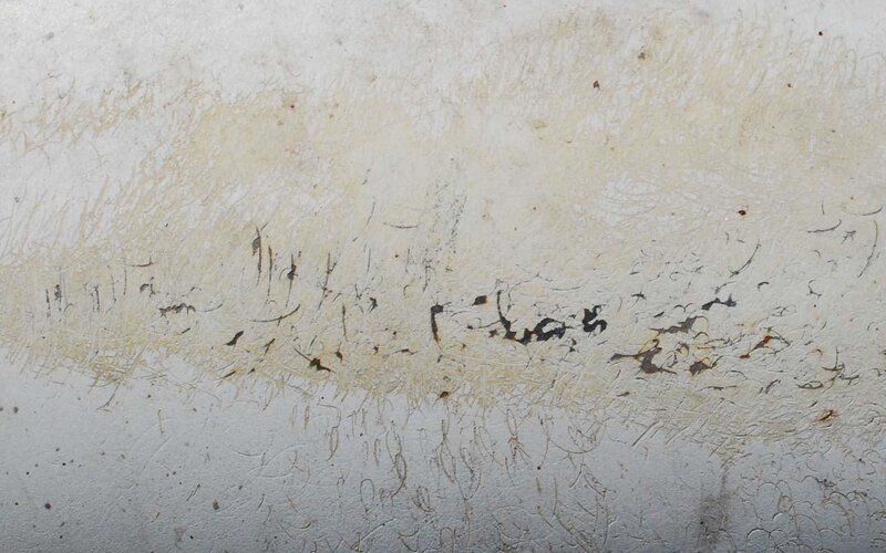 textured surface with stains