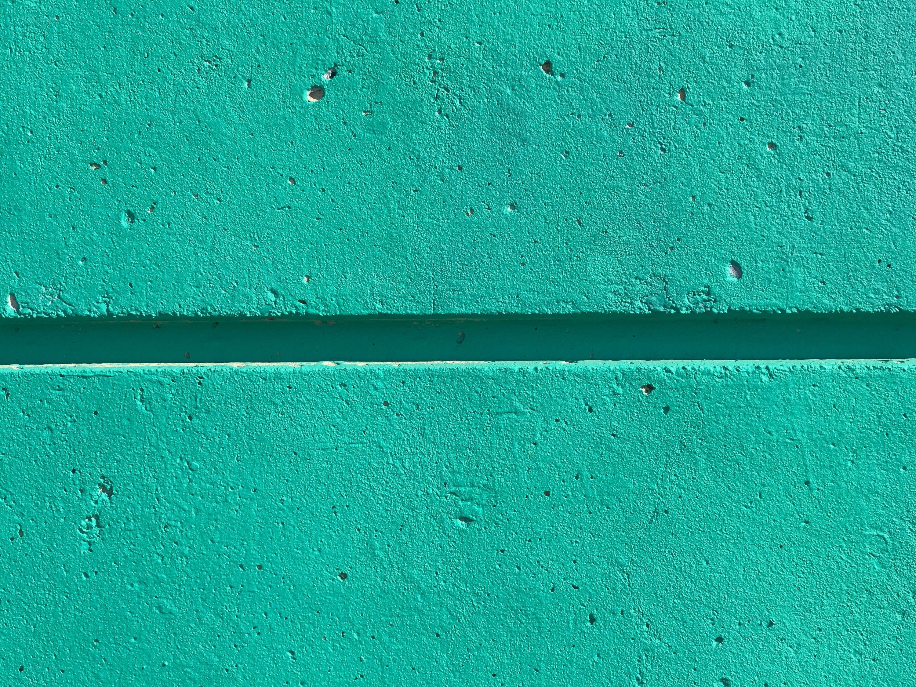 textured teal wall surface