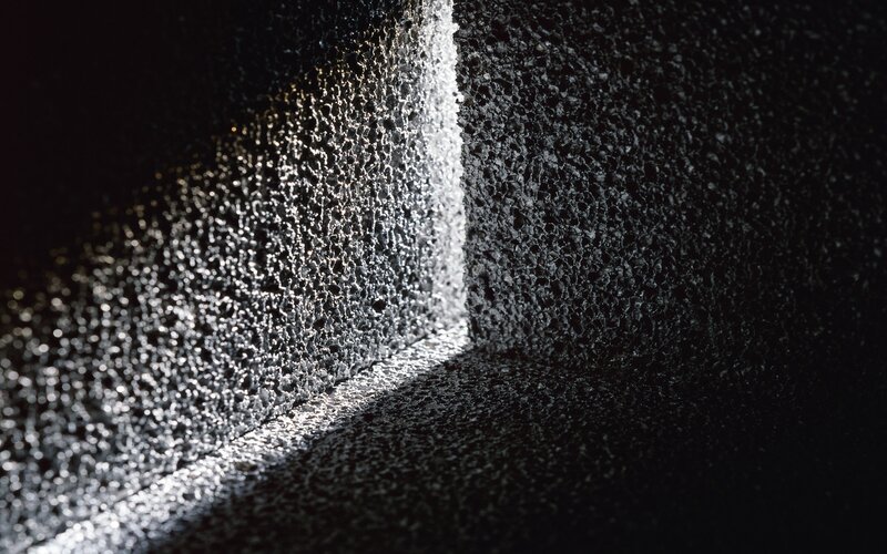 textured wall corner lit by light