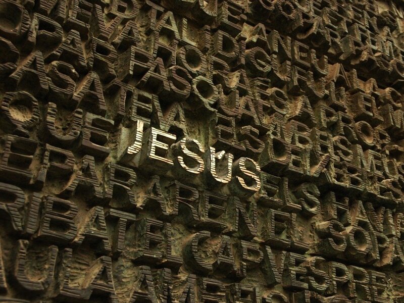 textured wall with carved letters