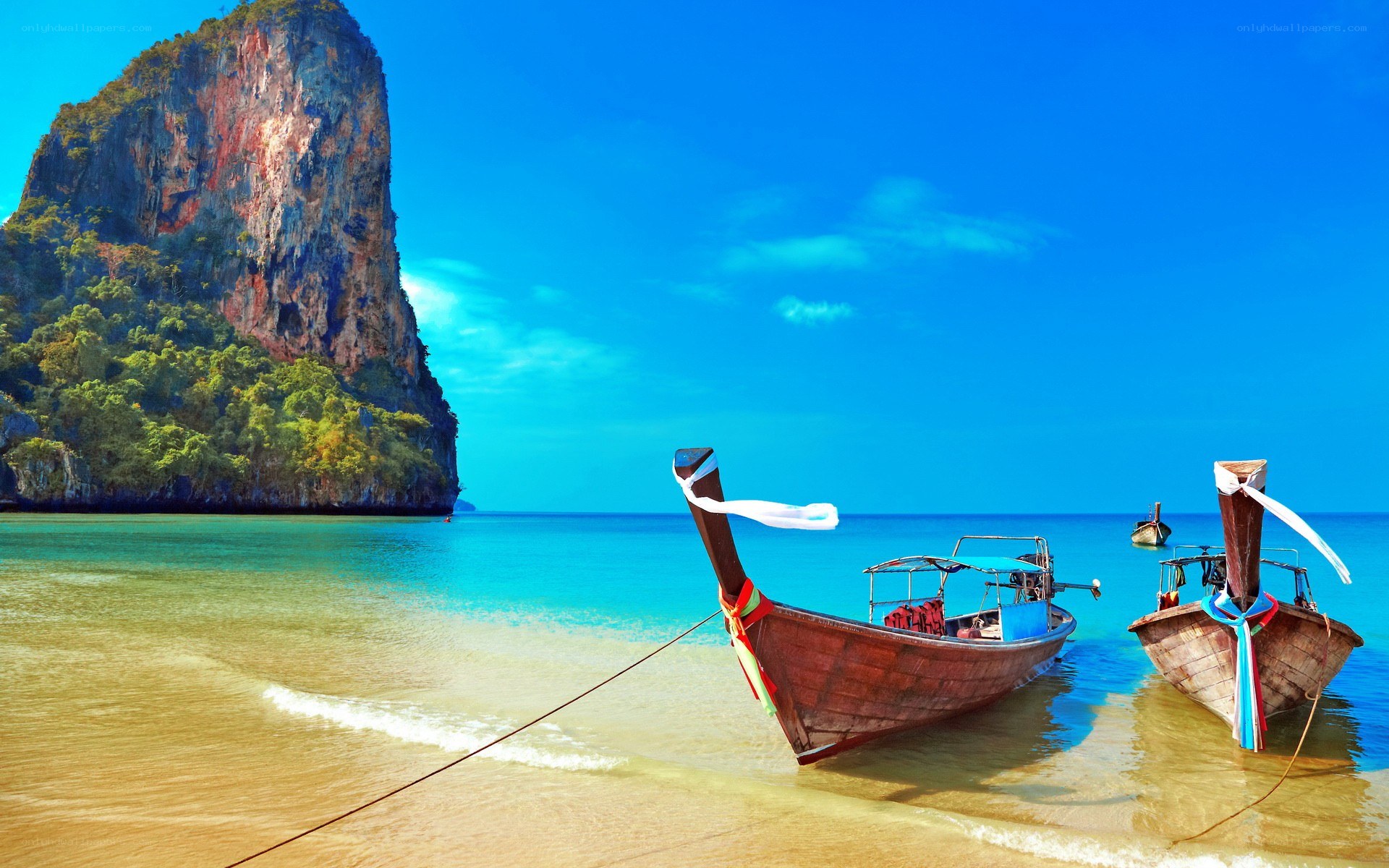 Thai beach with longtail boats