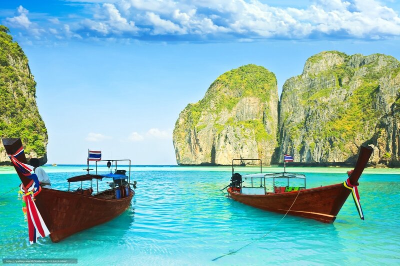 Thai longtail boats in turquoise water