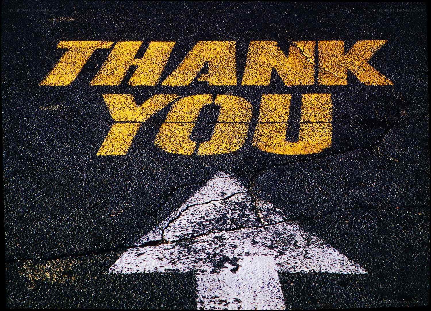 Thank you painted on asphalt
