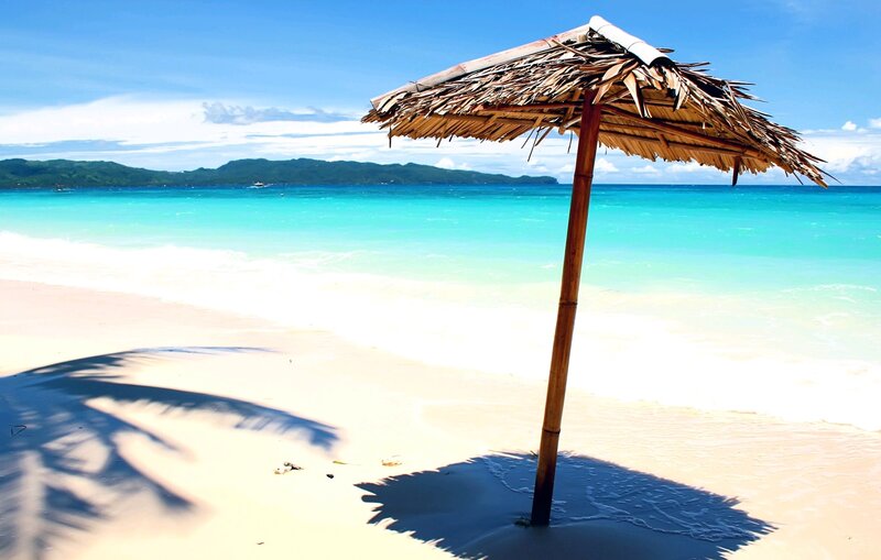 Thatched Beach Umbrella — Blue, Serene, Afternoon