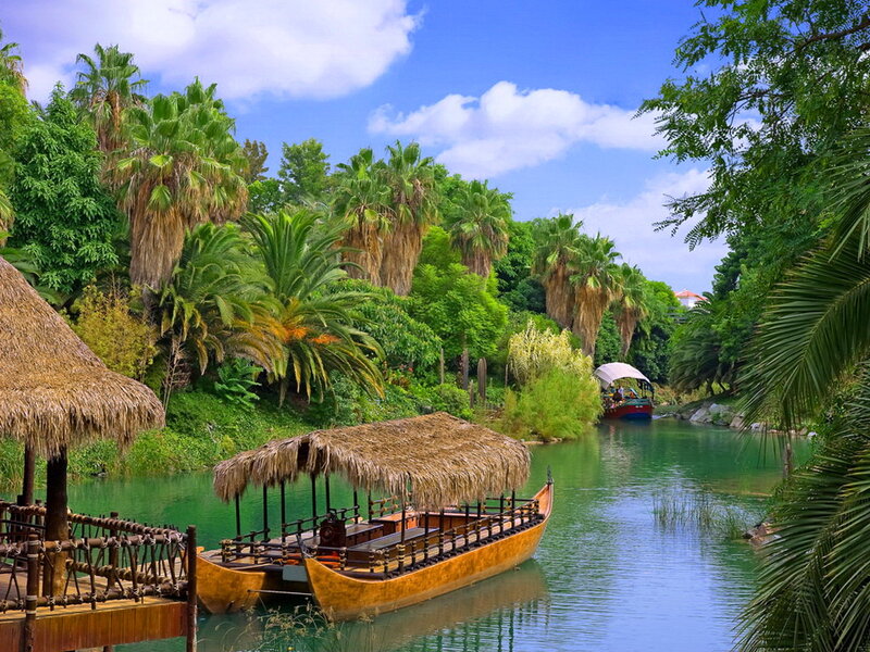 Thatched Boats on River