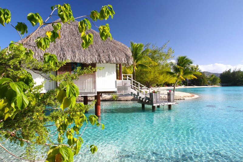 Thatched Bungalow on Water — Blue, Serene, Afternoon