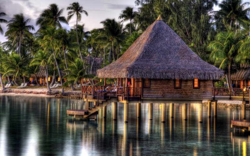 Thatched Bungalow on Water — Brown, Serene
