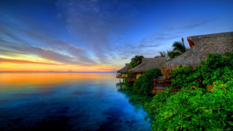Thatched Bungalows at Sunset
