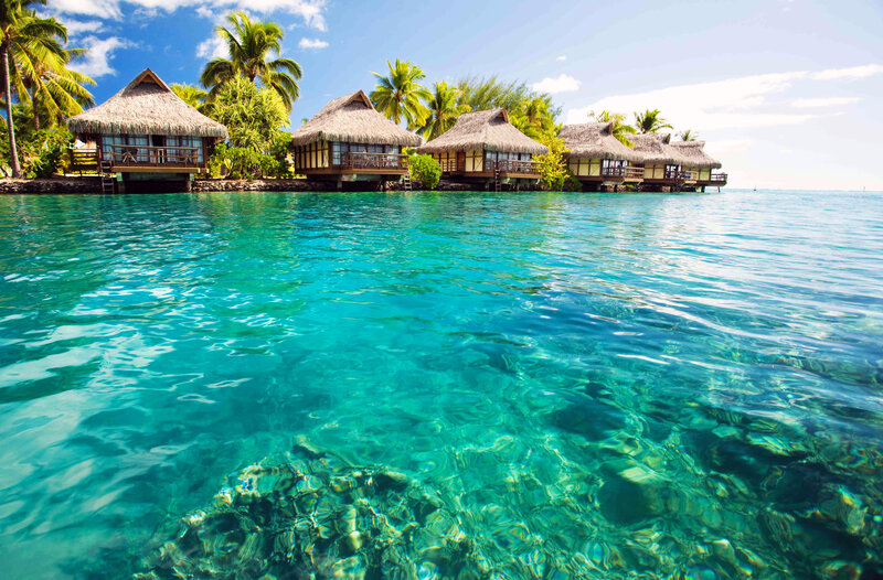 Thatched Bungalows on Water — Blue, Serene, Afternoon, Photograph, Palm Trees, Ocean